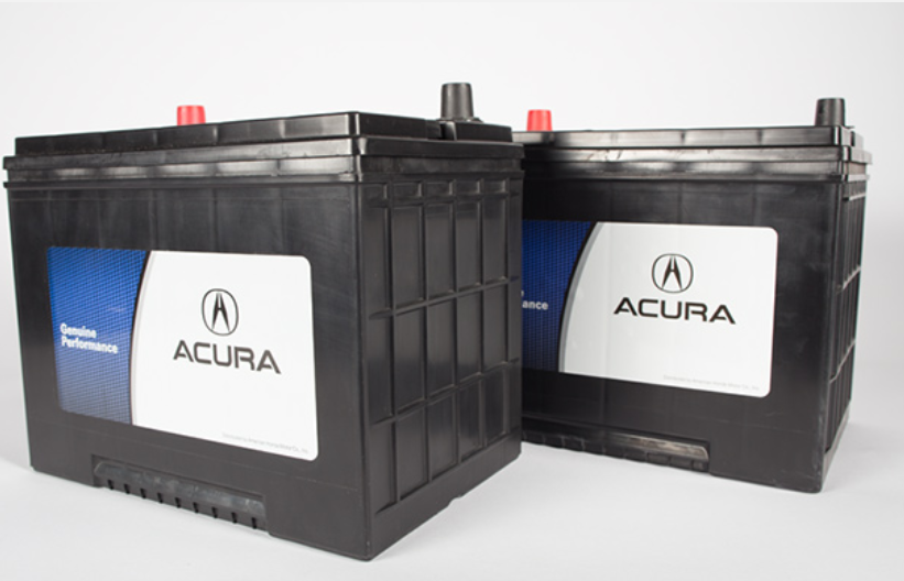 Two black Acura car batteries with red and black terminals, featuring a white label.
