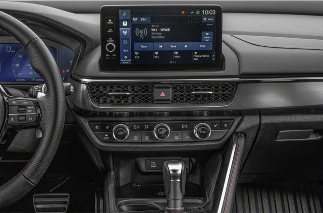 A 2025 Acura ADX dashboard showing a touchscreen display with radio controls and climate settings.