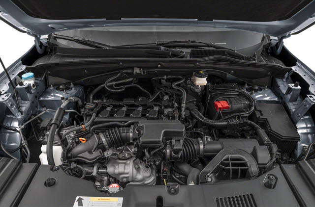 A 2025 Acura ADX engine under a raised hood, showing various components and hoses.