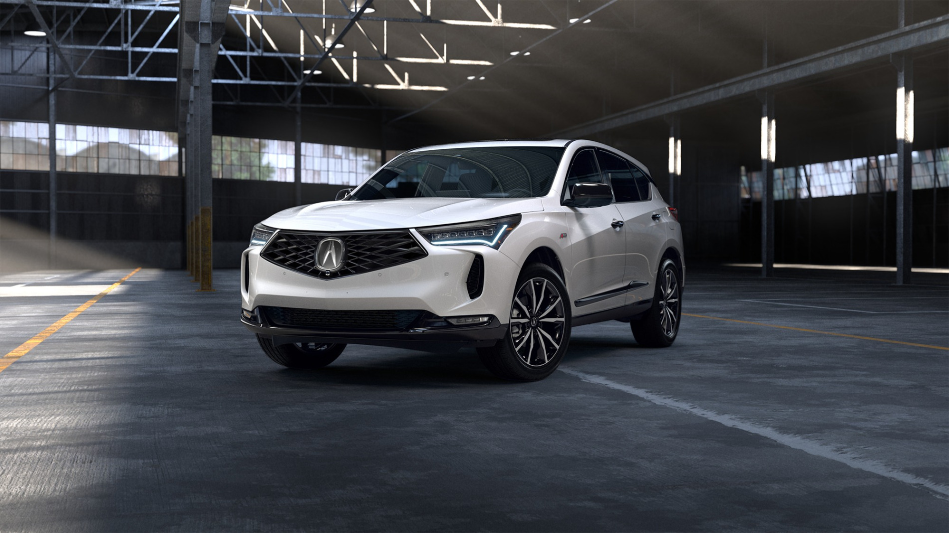2026 Acura MDX in black with sporty grille and alloy wheels.
